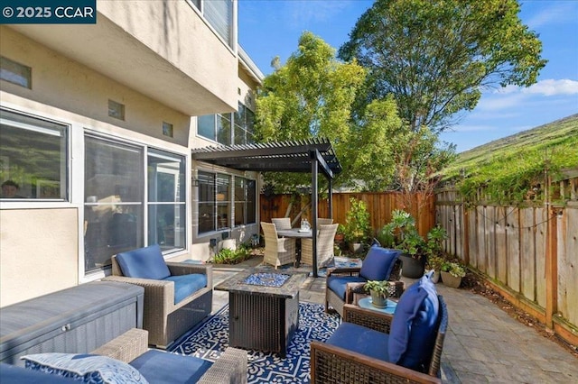 view of patio / terrace with a pergola and an outdoor living space with a fire pit