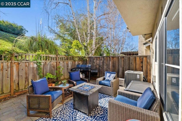 view of patio / terrace featuring an outdoor living space with a fire pit, grilling area, and central AC