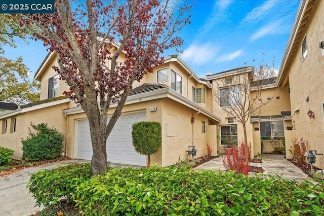 rear view of property featuring a garage