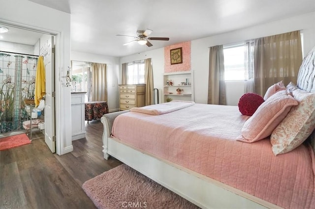 bedroom featuring ceiling fan, dark hardwood / wood-style flooring, and multiple windows