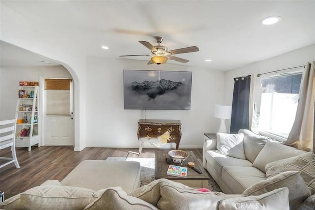 living room with ceiling fan and wood-type flooring