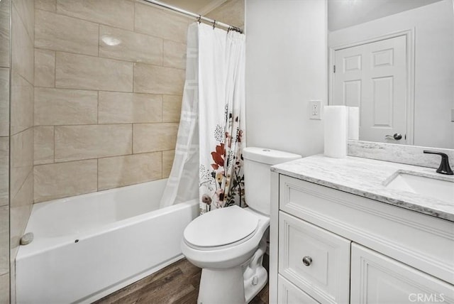 full bathroom featuring toilet, vanity, shower / tub combo, and hardwood / wood-style flooring