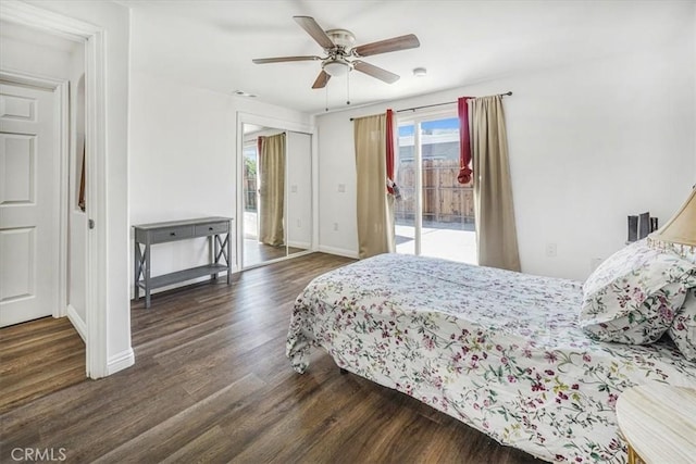 bedroom with ceiling fan, dark hardwood / wood-style floors, and access to outside