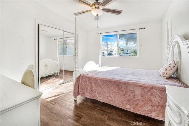 bedroom with ceiling fan, a closet, and hardwood / wood-style flooring