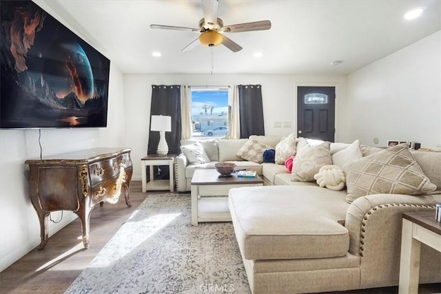 living room with ceiling fan and hardwood / wood-style floors