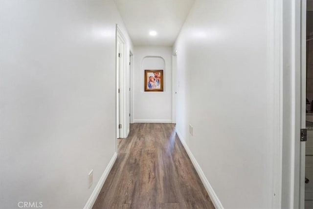 hallway featuring dark wood-type flooring