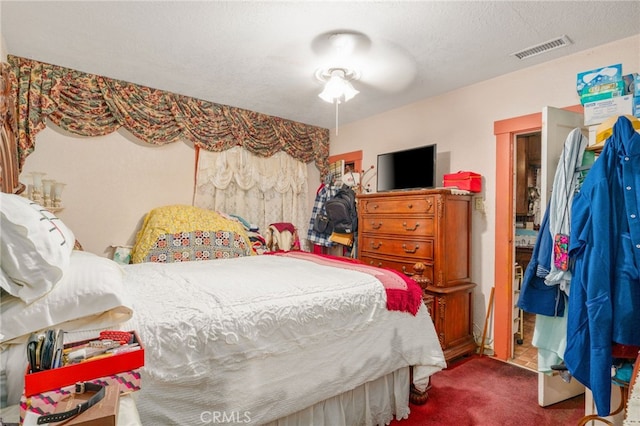 carpeted bedroom with a textured ceiling