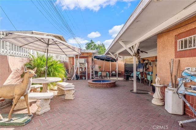 view of patio / terrace with a fire pit