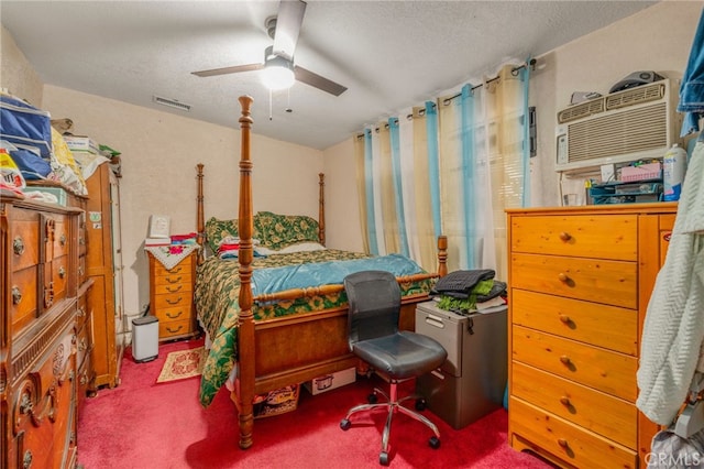 carpeted bedroom featuring ceiling fan and a textured ceiling