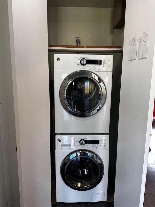 washroom with stacked washer and clothes dryer