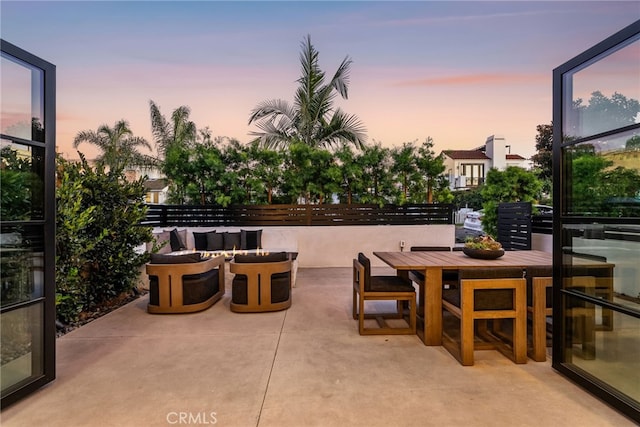 view of patio terrace at dusk