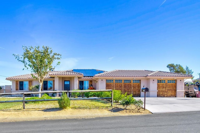 view of front of home featuring solar panels