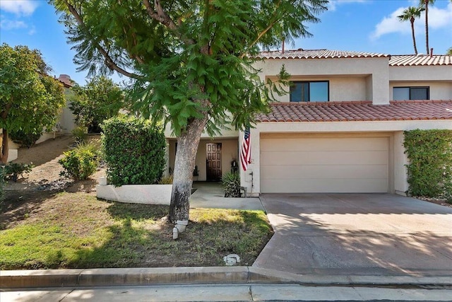 mediterranean / spanish-style home featuring a garage