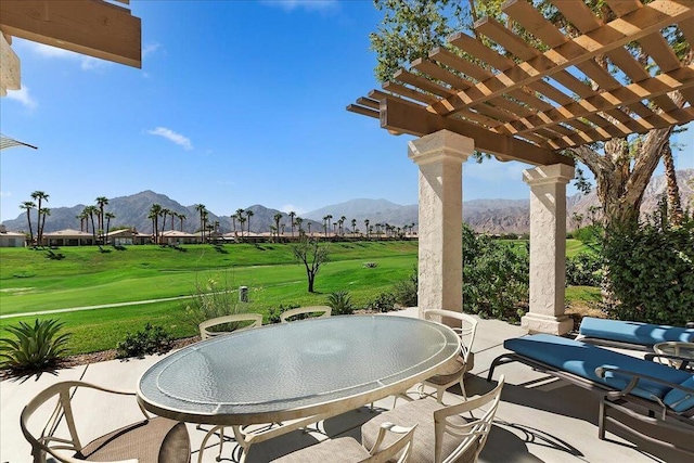 view of patio / terrace featuring a mountain view and a pergola