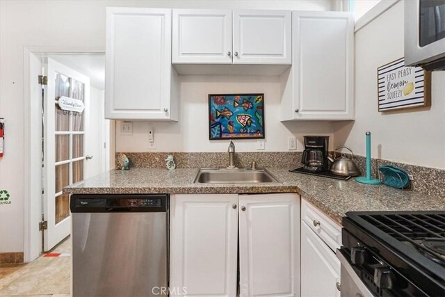 kitchen with white cabinetry, sink, and appliances with stainless steel finishes