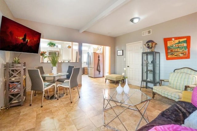 living room featuring beam ceiling