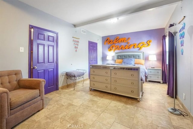 bedroom featuring beam ceiling