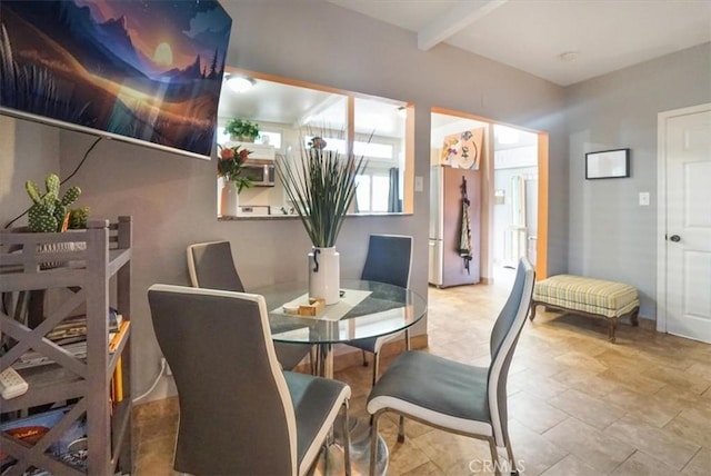 dining room featuring beam ceiling