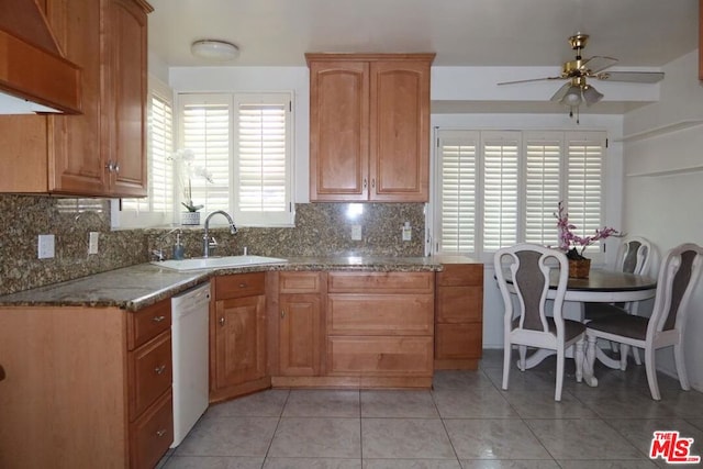 kitchen featuring ceiling fan, dishwasher, sink, backsplash, and light tile patterned floors