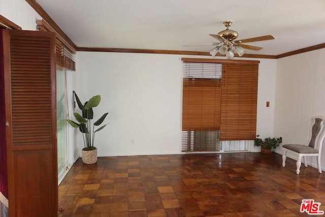 interior space featuring crown molding and ceiling fan