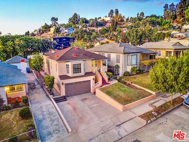 view of front of home featuring a front yard and a garage