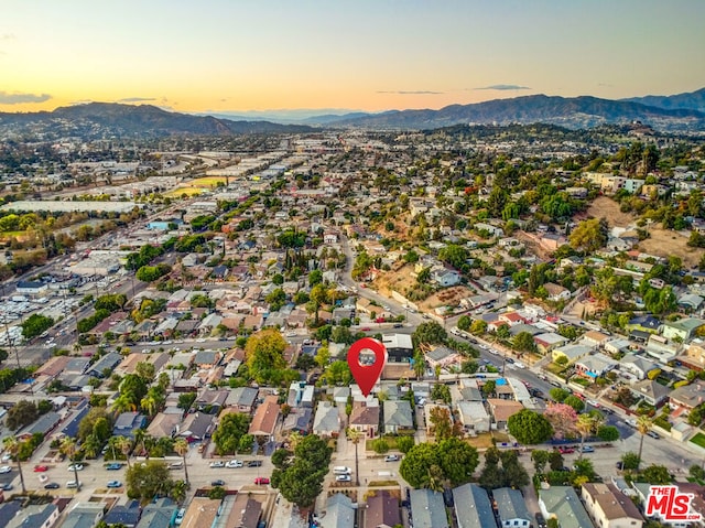 aerial view at dusk with a mountain view