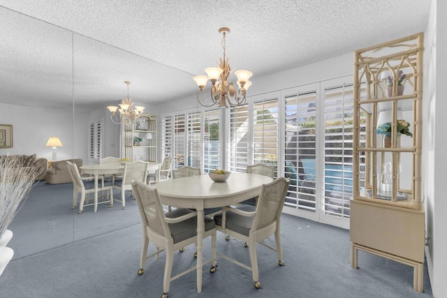 carpeted dining area featuring a chandelier and a textured ceiling