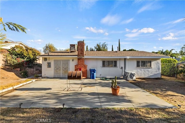 back of house with a patio area