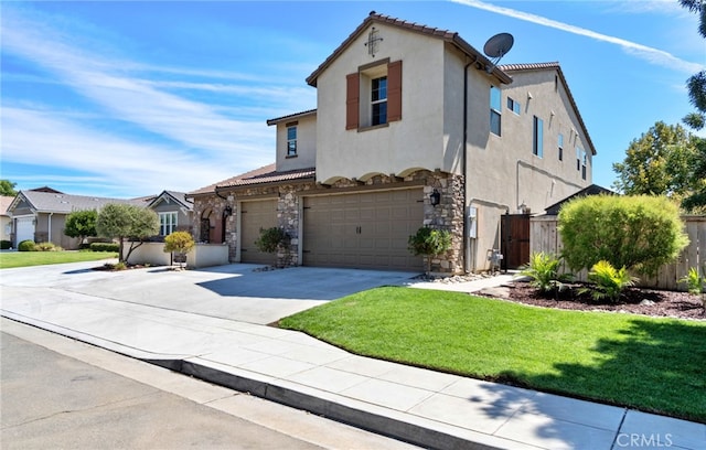 mediterranean / spanish home with a front yard and a garage