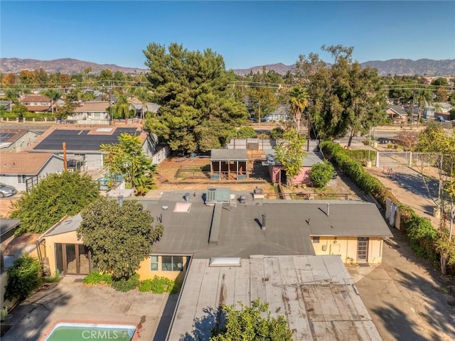 birds eye view of property with a mountain view