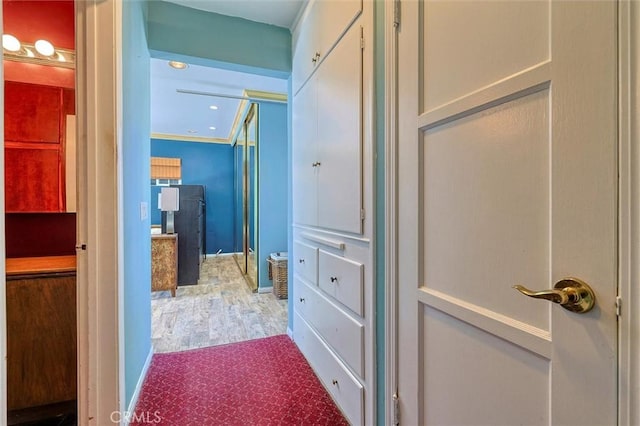 bathroom with hardwood / wood-style floors and crown molding