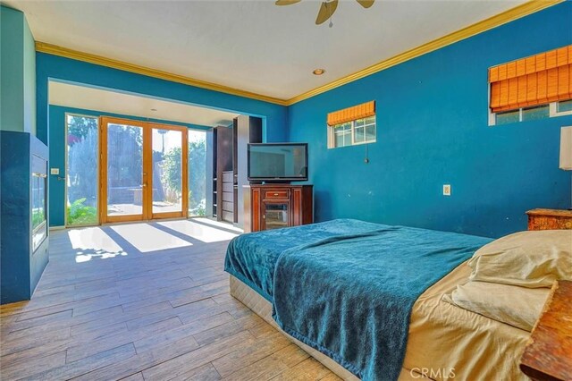 bedroom with wood-type flooring, ceiling fan, and ornamental molding