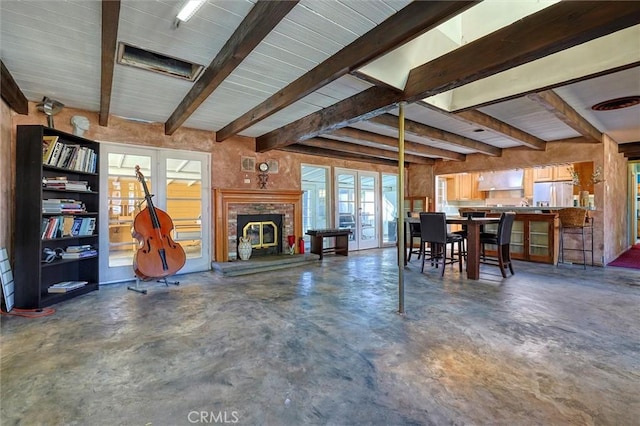 dining space with beam ceiling and a wealth of natural light