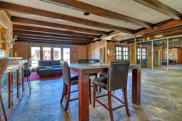 dining room featuring beam ceiling