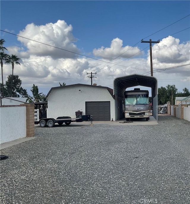 garage featuring a carport