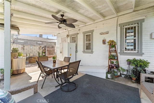 view of patio featuring ceiling fan