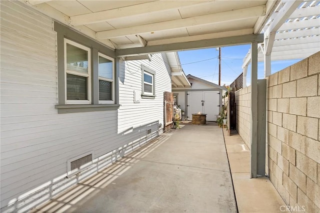 view of patio / terrace featuring a shed