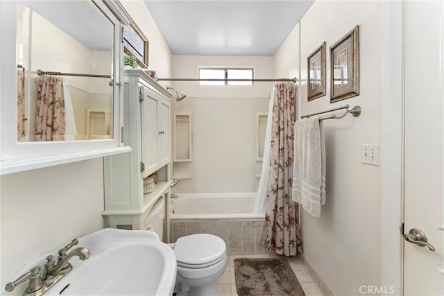 full bathroom featuring toilet, shower / bathtub combination with curtain, tile patterned flooring, and sink