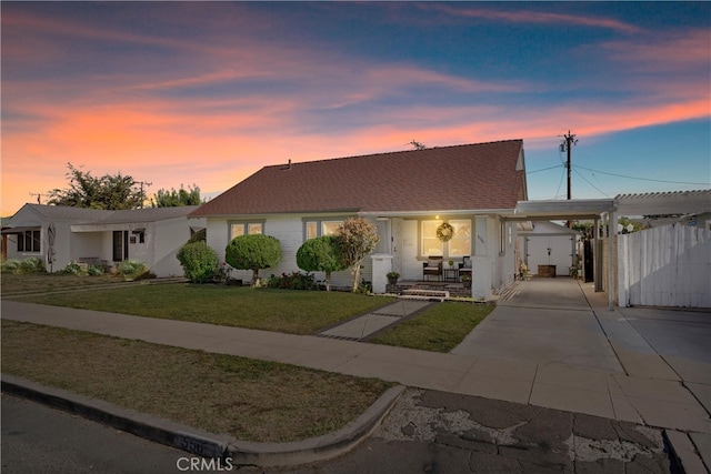 single story home featuring a yard