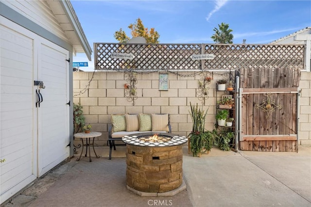 view of patio featuring a fire pit