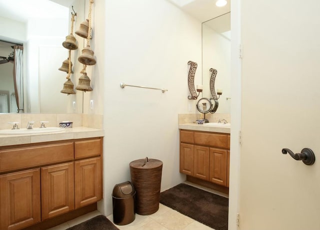 bathroom with tile patterned floors and vanity