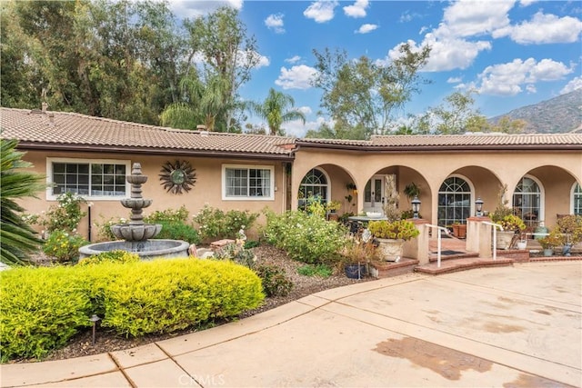 mediterranean / spanish-style house featuring a mountain view