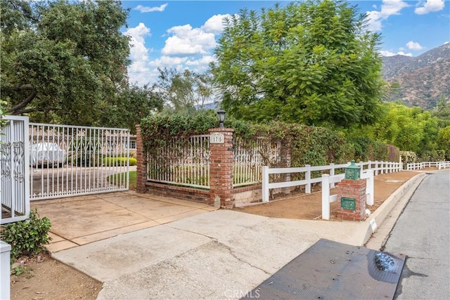 view of gate featuring a mountain view