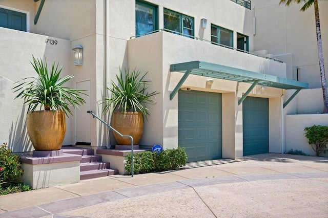 exterior space with a balcony and a garage