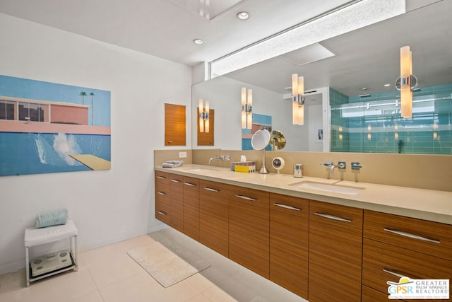 bathroom with tile patterned floors, vanity, and a shower with shower door