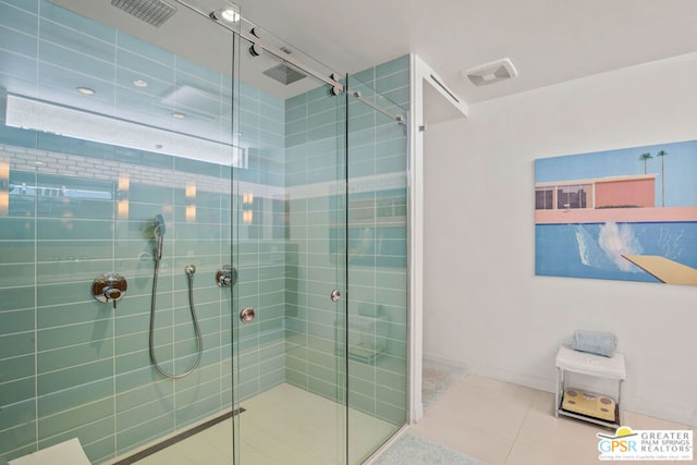 bathroom featuring tile patterned floors and an enclosed shower