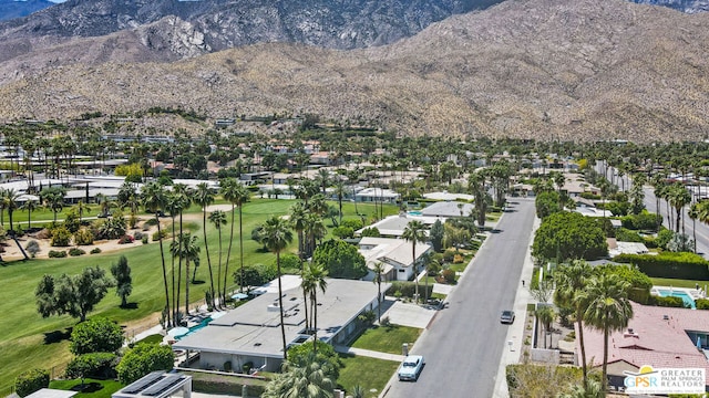 birds eye view of property with a mountain view