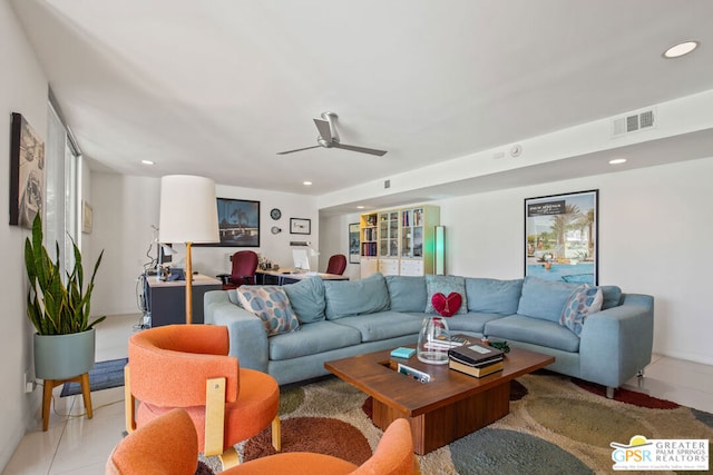 living room featuring ceiling fan and light tile patterned floors