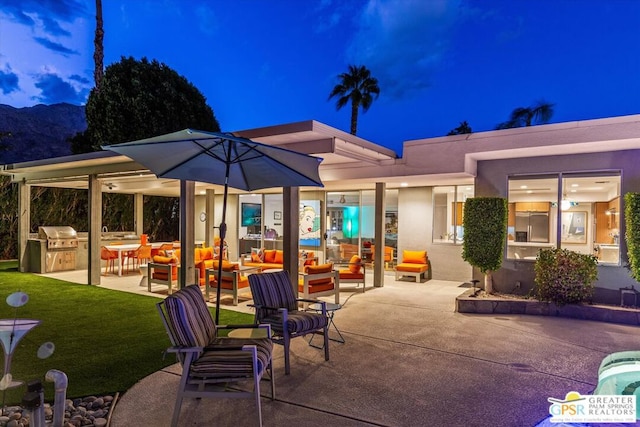 view of patio featuring outdoor lounge area, grilling area, and exterior kitchen