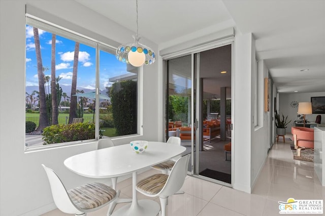 tiled dining area featuring a mountain view